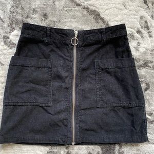 Top shop black corduroy mini with circle zip detail in size 6